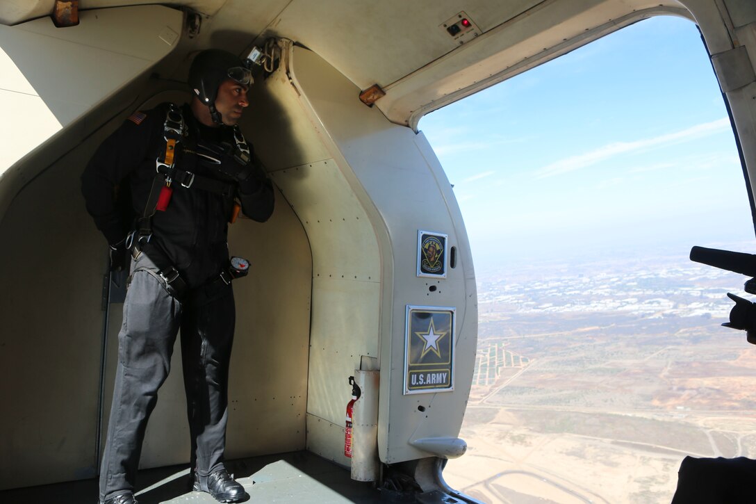 A member of the U.S. Army Golden Knights prepares to jump during the 2016 MCAS Miramar Air Show aboard Marine Corps Air Station Miramar, Calif., Sept. 23. The Golden Knights jump from a C-31A Troopship at an altitude of more than 12,000 feet. The MCAS Miramar Air Show showcases world-class performers, military flight demonstration teams, the capabilities of the Marine Air-Ground Task Force and celebrates Miramar’s longstanding relationship with the local San Diego community. (U.S. Marine Corps photo by Lance Cpl. Harley Robinson/Released)
