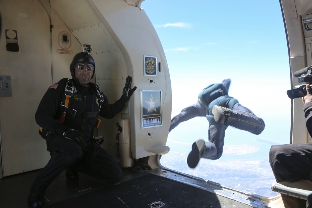 The U.S. Army Golden Knights parachute team performs at the 2016 MCAS Miramar Air Show aboard Marine Corps Air Station Miramar, Calif., Sept. 23. The Golden Knights jump from a C-31A Troopship at an altitude of more than 12,000 feet. The MCAS Miramar Air Show showcases world-class performers, military flight demonstration teams, the capabilities of the Marine Air-Ground Task Force and celebrates Miramar’s longstanding relationship with the local San Diego community. (U.S. Marine Corps photo by Lance Cpl. Harley Robinson/Released)