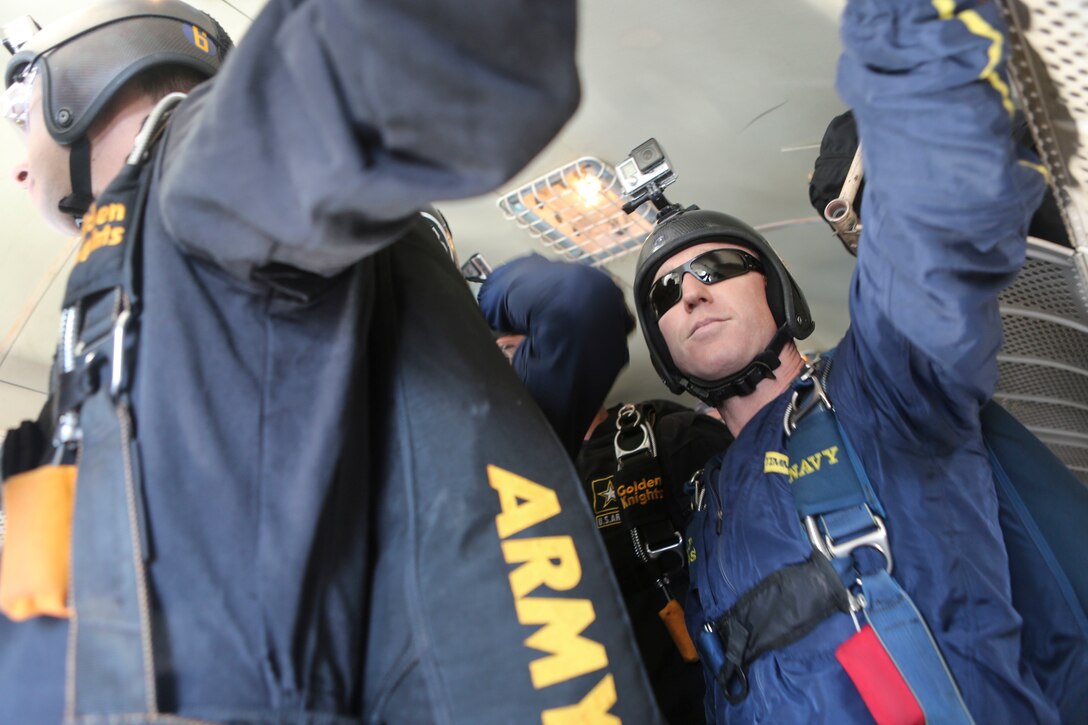 The U.S. Army Golden Knights parachute team prepares to jump at the 2016 MCAS Miramar Air Show aboard Marine Corps Air Station Miramar, Calif., Sept. 23. The Golden Knights jump from a C-31A Troopship at an altitude of more than 12,000 feet. The MCAS Miramar Air Show showcases world-class performers, military flight demonstration teams, the capabilities of the Marine Air-Ground Task Force and celebrates Miramar’s longstanding relationship with the local San Diego community. (U.S. Marine Corps photo by Lance Cpl. Harley Robinson/Released)