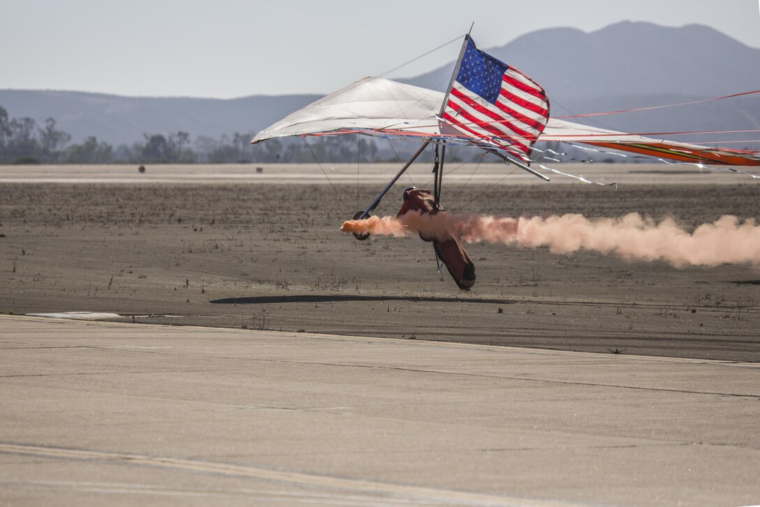 Dan Buchanan prepares to land his hang glider after his performance at the 2016 MCAS Miramar Air Show aboard Marine Corps Air Station Miramar, Calif., Sept. 23. Buchanan lost the use of his legs after suffering a spinal injury in 1981, but has since accrued more than 2,400 flight hours in hang gliders. The MCAS Miramar Air Show showcases world-class performers, military flight demonstration teams, the capabilities of the Marine Air-Ground Task Force and celebrates Miramar’s longstanding relationship with the local San Diego community. (U.S. Marine Corps photo by Pfc. Liah Kitchen/Released)