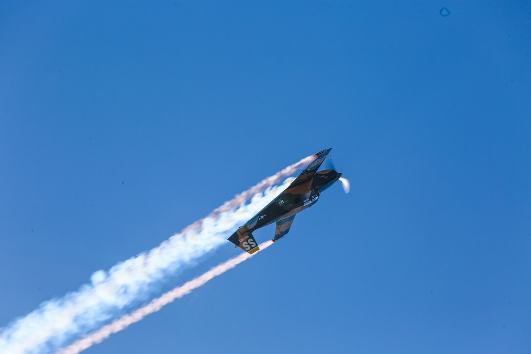 Pilot Steve Starvrakakis performs “A Tribute to the American Vet” in a Romanian IAR-823 during the 2016 MCAS Miramar Air Show aboard Marine Corps Air Station Miramar, Calif., Sept. 23. The IAR is painted in Air Force jungle camouflage colors and the markings of the 8th Special Operations Squadron stationed at Bien Hoa Air Base, Vietnam, in 1970. The MCAS Miramar Air Show showcases world-class performers, military flight demonstration teams, the capabilities of the Marine Air-Ground Task Force and celebrates Miramar’s longstanding relationship with the local San Diego community. (U.S. Marine Corps photo by Pfc. Jacob Pruitt/Released)