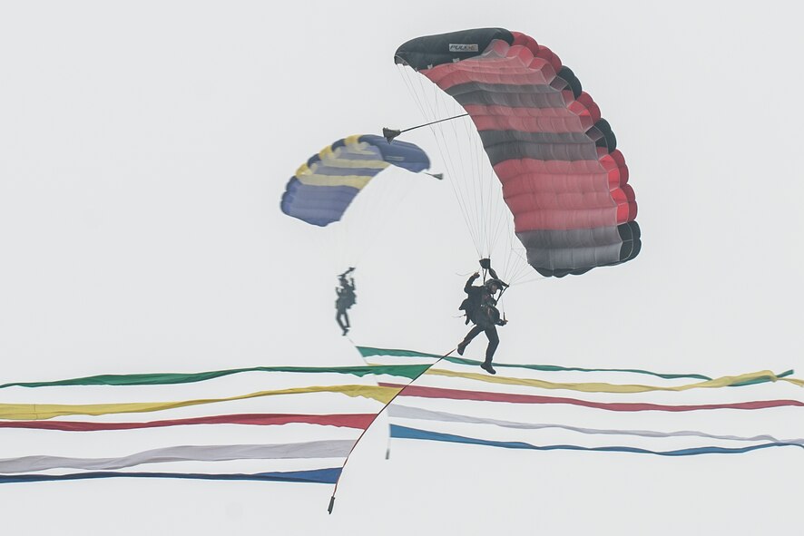 Parachutists with the Republic of Korea Parachute Demonstration Team perform aerial maneuvers to kick off Air Power Day 2016 at Osan Air Base, ROK, Sept. 25, 2016.  Members of Team Osan and the surrounding community participated in events for the air show such as static displays, aircraft takeoffs and aerial demonstrations. (U.S. Air Force photo by Senior Airman Dillian Bamman)