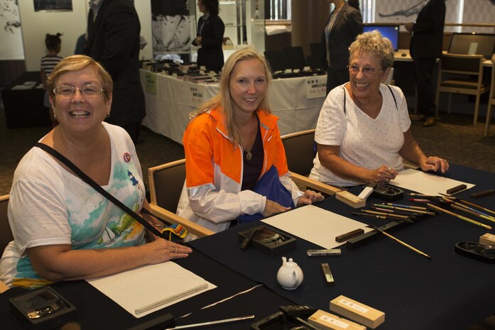 Marine Corps Air Station Iwakuni residents prepare to practice calligraphy at the Fudenosato Kobo Museum in Kumano, Japan, Sept. 22, 2016. Air station residents traveled to Kumano with the Cultural Adaptation Program for an opportunity to experience calligraphy and tradition during the festival and visited the Fudenosato Kobo Museum, where they learned how calligraphy equipment is made. (U.S. Marine Corps photo by Lance Cpl. Joseph Abrego)