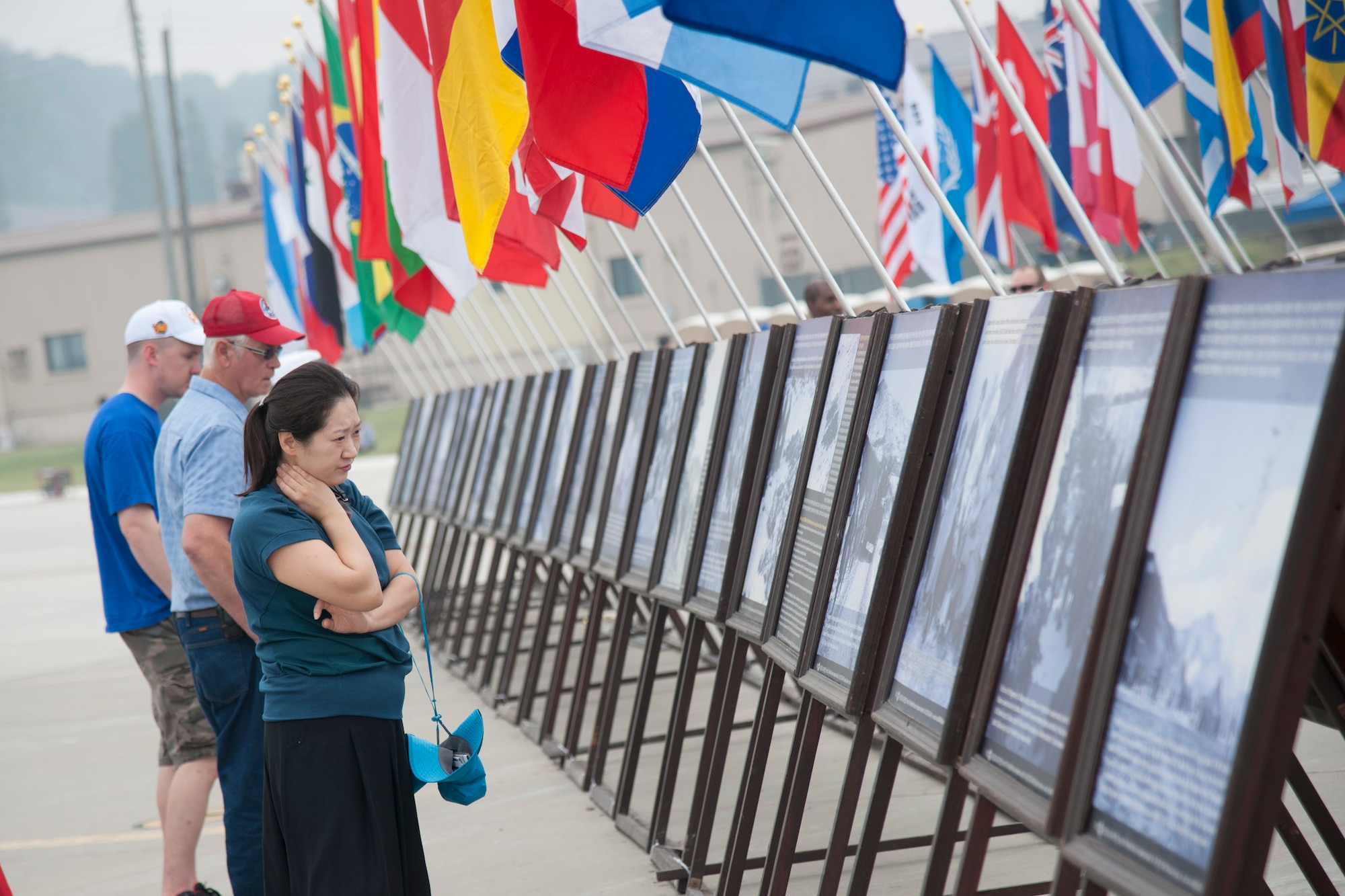 Crowds looks at the Korean War memorial photos exhibit at Air Power Day 2016 on Osan Air Base, Republic of Korea, Sept 25, 2016. Air Power Day had a variety of static displays including aircrafts, weapons load, and booths featuring units throughout Osan. (U.S. Air Force photo by Staff Sgt. Jonathan Steffen)