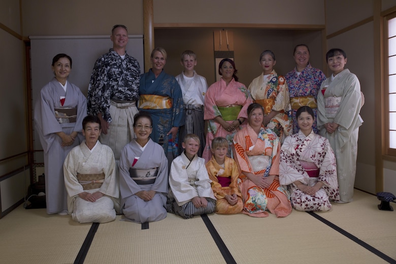 Instructors from the Yayoi Kimono Shop and Cultural School pose for photos with Status of Forces Agreement personnel who participated in a Japanese Tea Ceremony Class Sept. 17, 2016, in Naha, Okinawa, Japan. The class provided SOFA personnel with the opportunity to experience Japanese traditions firsthand. The students learned how to politely partake of tea and refreshments and how to prepare and serve the matcha, which is a powdered green tea commonly served at tea ceremonies. (U.S. Marine Corps photo by Cpl. Janessa K. Pon)