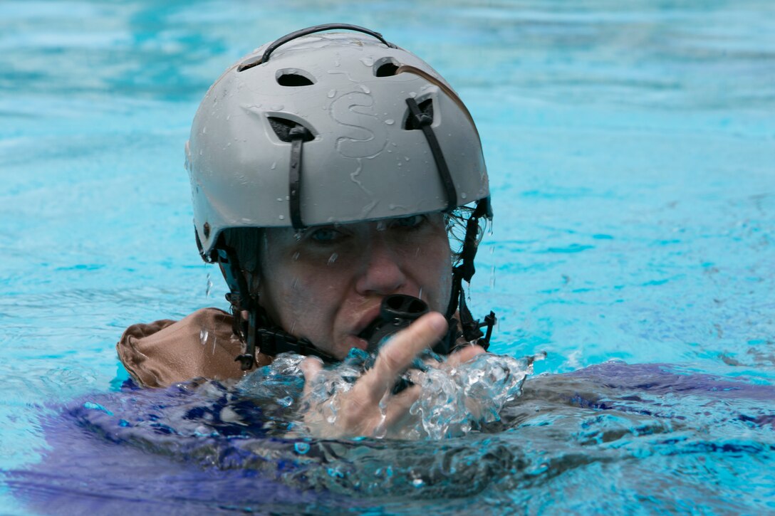 Elizabeth Blanchford, an employee at USAID's Office of U.S. Foreign Disaster Assistance (OFDA) and recent addition to the 3rd Marine Expeditionary Brigade, participates in Modular Amphibious Egress Training - also known as the "Helo Dunker" - on Camp Hansen, Okinawa, Japan, Sept. 21, 2016. The Helo Dunker is designed to teach survival techniques in the event a helicopter lands in the water. Blanchford, from Bozeman, Mont., fills a key facilitation role for the MEB during humanitarian aid and disaster relief scenarios. The mission of OFDA is to save lives, alleviate human suffering and reduce the economic and social impact of disasters. Blanchford helps the MEB maximize unique military capabilities which can directly assist in supporting OFDA's mission in times of crisis. (U.S. Marine Corps photo by MCIPAC Combat Camera by Lance Cpl. Damon Mclean/Released)