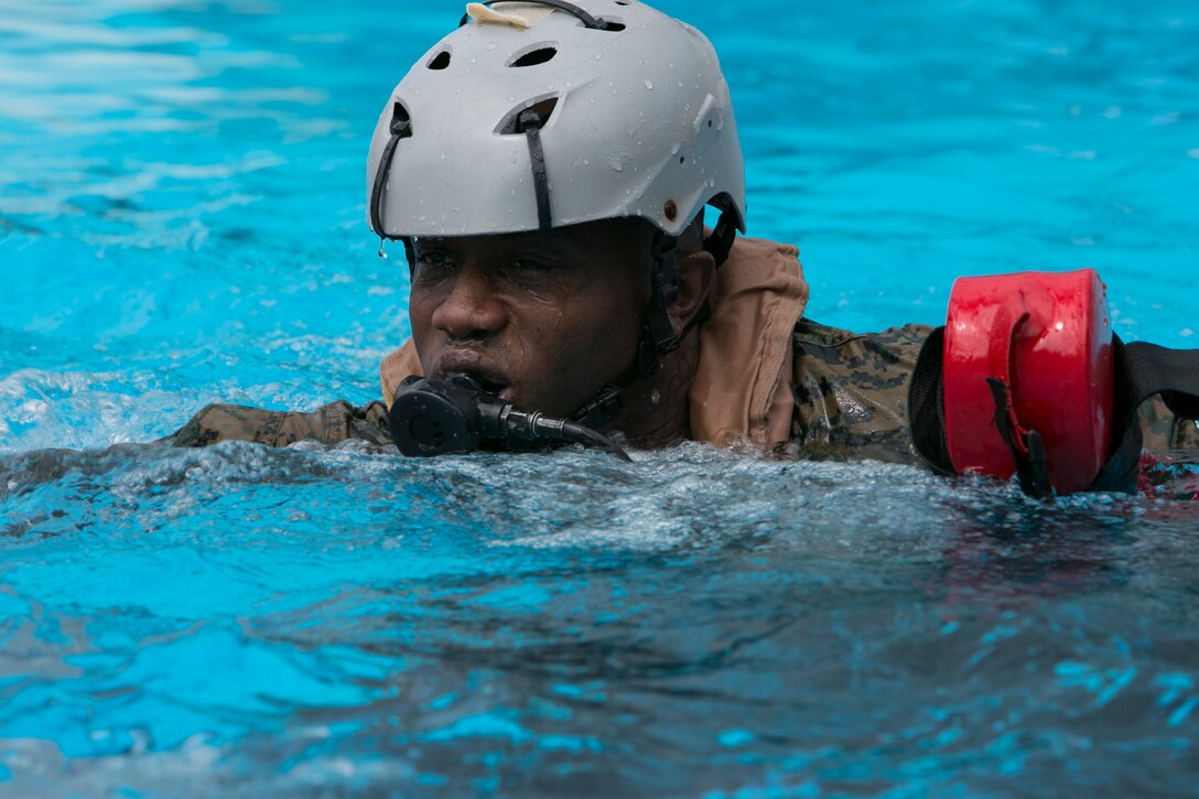 U.S. Marine Corps Maj. Atiim Phillips, from Chesapeake, Va.,participates in Modular Amphibious Egress Training on Camp Hansen, Okinawa, Japan, Sept. 21, 2016. The Helo Dunker simulation is designed to teach Marines survival techniques in the event a helicopter lands in water. Phillips serves as the 3rd Marine Expeditionary Brigade communications officer. (U.S. Marine Corps photo by MCIPAC Combat Camera by Lance Cpl. Damon Mclean/Released)