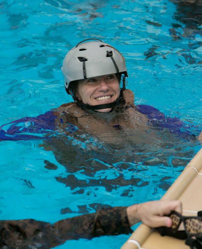 Elizabeth Blanchford, an employee at USAID's Office of U.S. Foreign Disaster Assistance (OFDA) and recent addition to the 3rd Marine Expeditionary Brigade, participates in Modular Amphibious Egress Training - also known as the "Helo Dunker" - on Camp Hansen, Okinawa, Japan, Sept. 21, 2016. The Helo Dunker is designed to teach survival techniques in the event a helicopter lands in the water. Blanchford, from Bozeman, Mont., fills a key facilitation role for the MEB during humanitarian aid and disaster relief scenarios. The mission of OFDA is to save lives, alleviate human suffering and reduce the economic and social impact of disasters. Blanchford helps the MEB maximize unique military capabilities which can directly assist in supporting OFDA's mission in times of crisis. (U.S. Marine Corps photo by MCIPAC Combat Camera by Lance Cpl. Damon Mclean/Released)