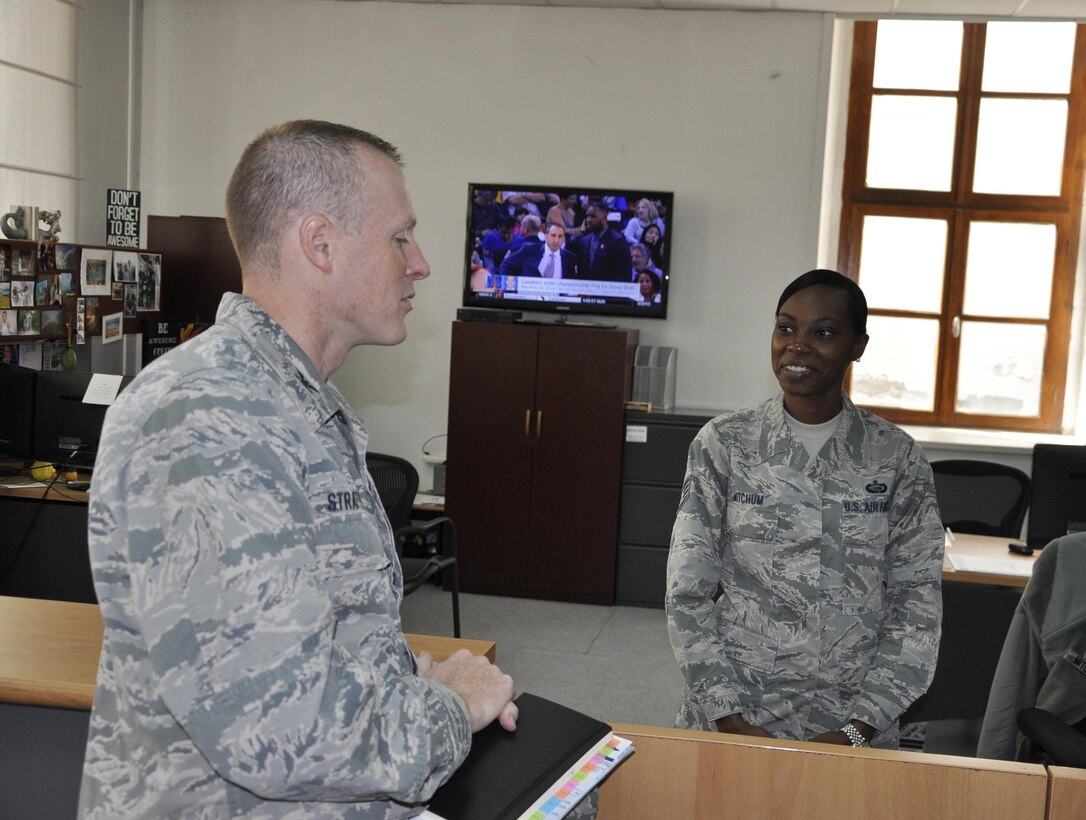 Staff Sgt. Jessica Mitchum, 425th Air Base Squadron commander’s support staff, briefs Col. Todd Stratton, 39th Mission Support Group commander, about commander’s support staff programs during his visit Sept. 16, 2016. (Photo by Tanju Varlıklı)
