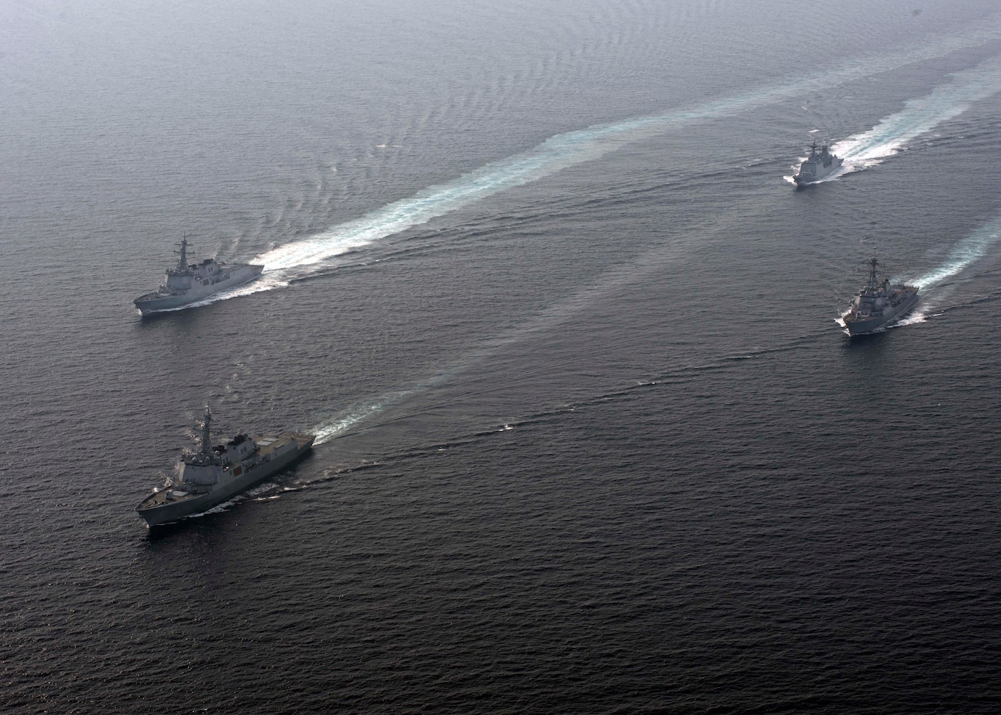 WATERS EAST OF THE KOREAN PENINSULA (Sept. 26, 2016) U.S. Navy and Republic of Korea Navy (ROKN) ships maneuver together during a combined maritime operation. ROKS Seoae Ryusungryong (DDG 993) (lead ship) ROKS Yul Gok Yii (DDG 992), (Clockwise) ROKS Kang Gam Chan (DDH 979) and U.S. Arleigh Burke-class guided-missile destroyer USS Spruance (DDG 111). 