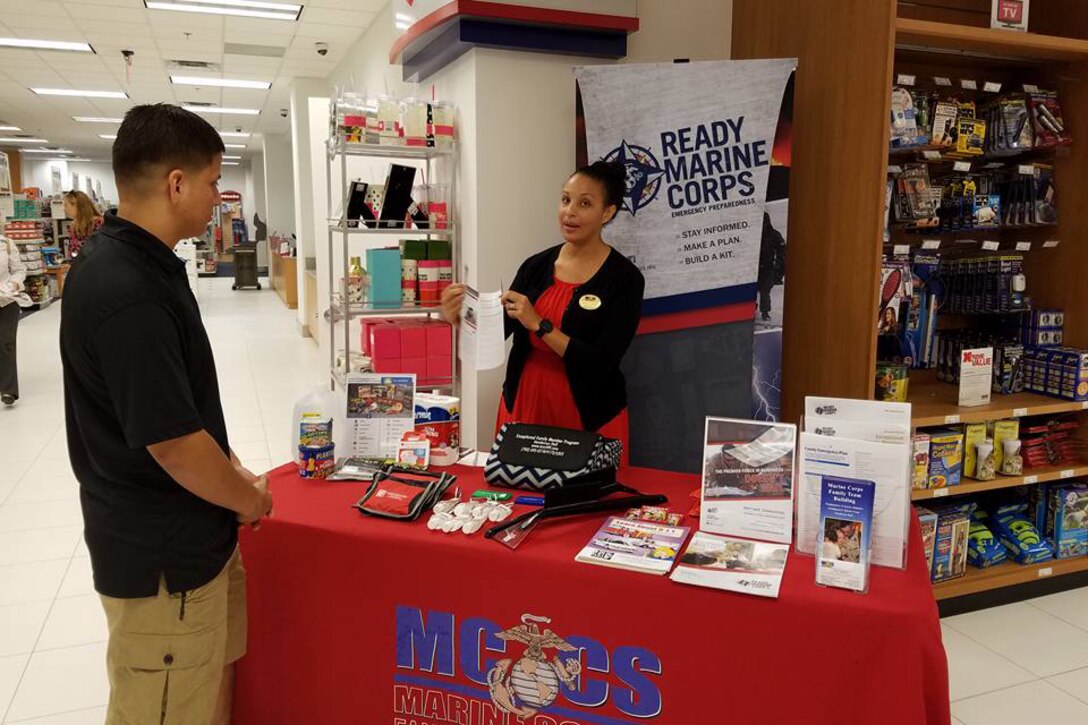 Zeyna Anderson, a trainer with Marine Corps Family Team Building, discusses how to make an emergency plan during a Marine Corps community services outreach event at Joint Base Myer-Henderson Hall, Sept. 23, 2016. Photo by MCCS Henderson Hall  