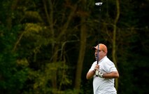 A retired service member watches his golf ball travel across the green during the Army and Air Force Challenge golf tournament Sept. 18, 2016, at Rheinblick Golf Course, Wiesbaden, Germany.  Airmen took home the trophy for the third year in a row, with a score of 39-33. (U.S. Air Force photo by Senior Airman Nicole Keim)
