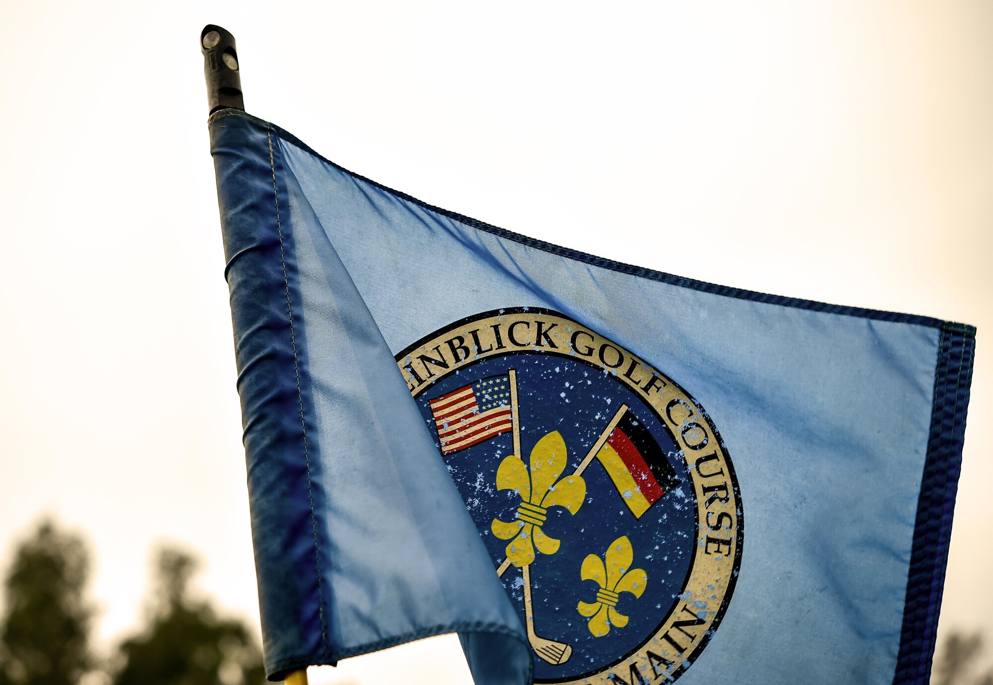 A Rheinblick Golf Course flag waves in the wind during the Army and Air Force Challenge Match golf tournament Sept. 18, 2016, at Rheinblick Golf Course, Wiesbaden, Germany.  Airmen took home the trophy for the third year in a row, with a score of 39-33. (U.S. Air Force photo by Senior Airman Nicole Keim)
