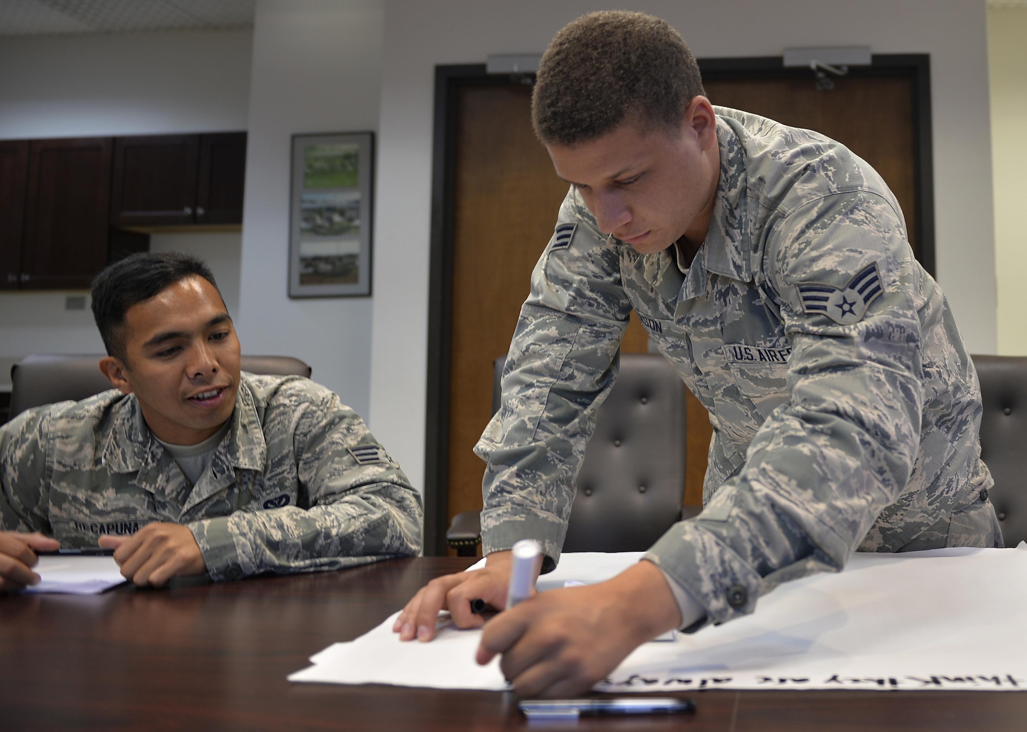 Senior Airman Adam Gleason (right), an engineering apprentice with the 1st Special Operations Civil Engineer Squadron, and Senior Airman Giannalessandro Recapuna, an execution support journeyman with the 1st SOCES, participate in a relationship exercise during the “How to Not Marry a Jerk” class at Hurlburt Field, Fla., Sept. 21, 2016. This class is part of the 1st Special Operations Mission Support Group Resilience Week, which is designed to provide Airmen with reintegration and resilience training. (U.S. Air Force photo by Senior Airman Andrea Posey)