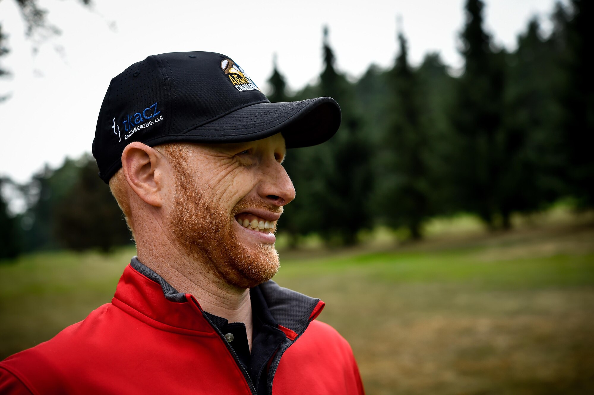 Thomas Connell, 5th Signal Command systems administrator, watches as his teammate hits a golf ball during the Army and Air Force Challenge Match golf tournament Sept. 18, 2016, at Rheinblick Golf Course, Wiesbaden, Germany.  More than 50 service-affiliated members of the Air Force and Army participated in the annual tournament. (U.S. Air Force photo by Senior Airman Nicole Keim)
