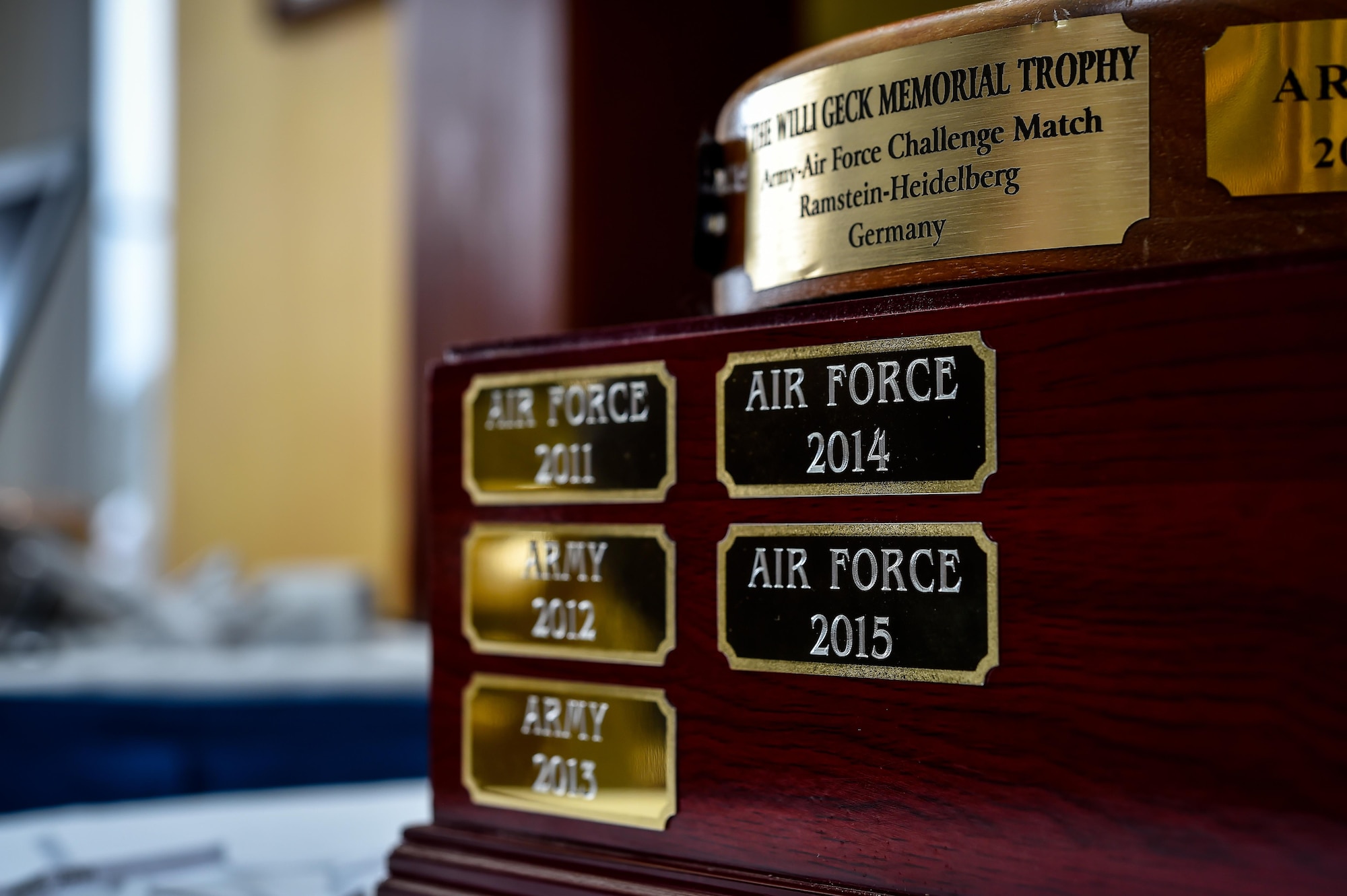 The Willi Geck Memorial Trophy rests on a table after being awarded to Air Force participants during the Army and Air Force Challenge Match golf tournament Sept. 18, 2016, at Rheinblick Golf Course, Wiesbaden, Germany.  Airmen took home the trophy for the third year in a row, with a score of 39-33. (U.S. Air Force photo by Senior Airman Nicole Keim)