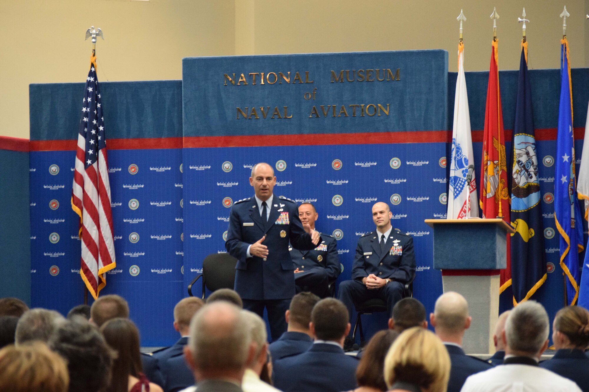 Lt. Gen. Jeffrey Harrigian, commander of U.S. Air Force Central Command addresses Combat Systems Officer Class 16-15 graduates and their loved ones at a ceremony Sept. 16, 2016 inside the National Naval Air Museum on Naval Air Station Pensacola, Fla.  The combat systems officers course, trains Airmen to perform duties as electronic warfare officers, weapons systems officers, and panel navigators.(U.S. Air Force photo by Capt. Meghan O'Rourke)