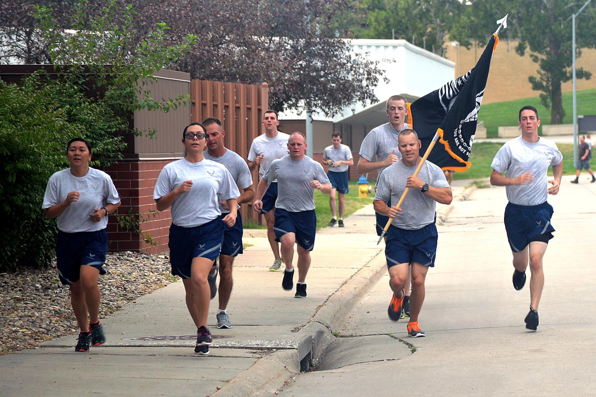 Members of Team Offutt participate in a POW/MIA 5k run Sept. 9 at Offutt Air Force Base, Nebraska to honor prisoners of war and service members missing in action. (U.S. Air Force photo by Kendra Williams)