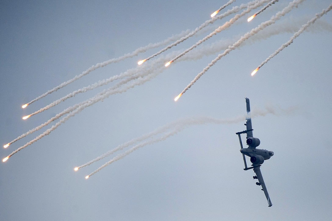 An A-10 Thunderbolt II shoots flares during Air Power Day 2016 at Osan Air Base, South Korea, Sept. 25, 2016. The Thunderbolt, assigned to the 25th Fighter Squad, demonstrated its capabilities to perform combat search and rescue missions during the air show. Air Force photo by Staff Sgt. Jonathan Steffen