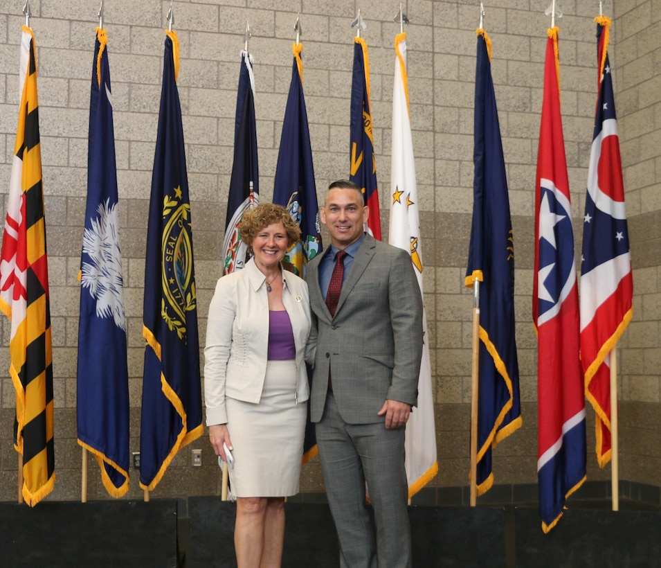 Congresswoman Susan Brooks, U.S. Representative from the 5th District, Ind., stands with Mr. Cody Smith, 310th Sustainment Command (Expeditionary) Equal Opportunity Representative, after speaking about the history and achievements of women in the military and U.S. society, as well as women veteran issues during the 310th Sustainment Command (Expeditionary) 2016 Women’s Equality Day Observance, 26 Aug., 2016.