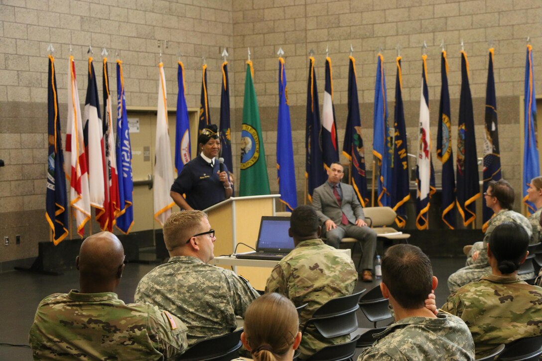 Ms. Mary L. Aurtrey, American Legion Women's Post 438 chaplain, speaks about the history and achievements of women in the military and U.S. society, as well as women veteran issues during the 310th Sustainment Command (Expeditionary) 2016 Women’s Equality Day Observance, 26 Aug., 2016.