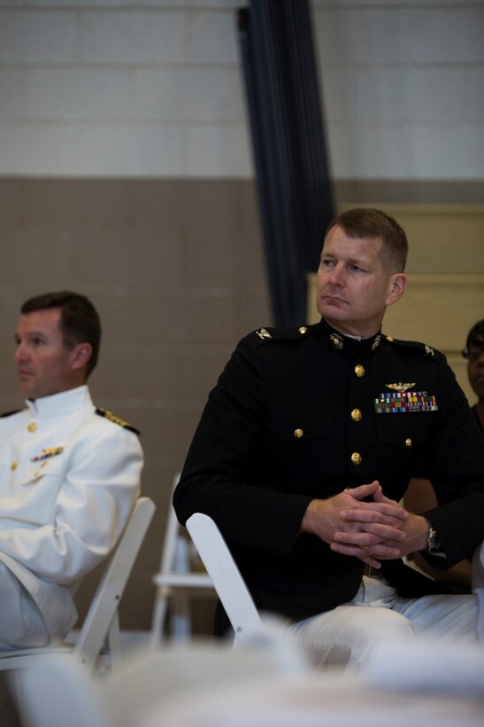 Col. Derrick R. Heyl the commanding officer of Headquarters Battalion, Marine Forces Reserve, listens to the opening remarks of the Gold Star Mothers and Family Day celebration at Naval Air Station Joint Reserve Base New Orleans, Sept. 25, 2016. The celebration honors the sacrifice that all Gold Star Family members make when a loved one has died in service to the nation. (U.S. Marine Corps photo by Cpl. Melissa Martens/ Released) 