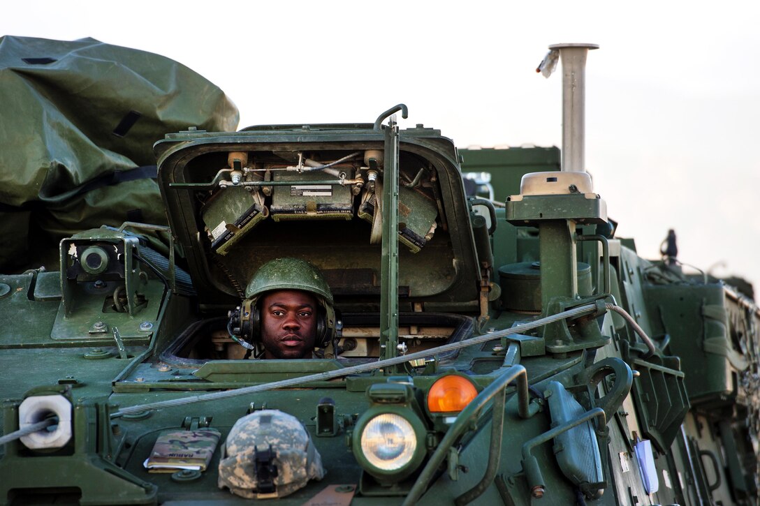 A soldier prepares to drive a Stryker armored vehicle onto a C-17 Globemaster III aircraft during Exercise Cerberus Strike 16-02 at Fort Carson, Colo., Sept. 16, 2016. The soldier is assigned to the 4th Infantry Division's 1st Stryker Brigade Combat Team. Air Force photo by Master Sgt. Joseph Swafford