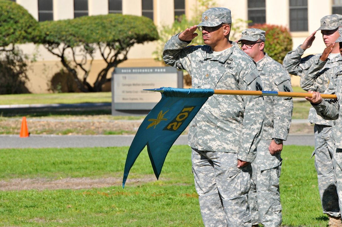 Maj. Anthony John, operations officer, 201st Press Camp Headquarters, Bell, Calif., salutes during the national anthem prior to the start of the 63rd Regional Support Command’s change of command ceremony, Sept. 25, Moffett Field, Mountain View, Calif. (U.S. Army Reserve photo by Capt. Alun Thomas)