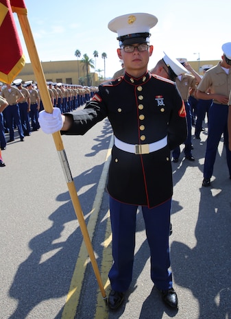 Lance Corporal Draven Crowley, Platoon 2130, Fox Company, 2nd Recruit Training Battalion, stands at parade rest prior to graduation at Marine Corps Recruit Depot San Diego, Sept. 23. Crowley is a Bonham, Texas, native and was recruited out of RS Dallas. Annually, more than 17,000 males recruited from the Western Recruiting Region are trained at MCRD San Diego.