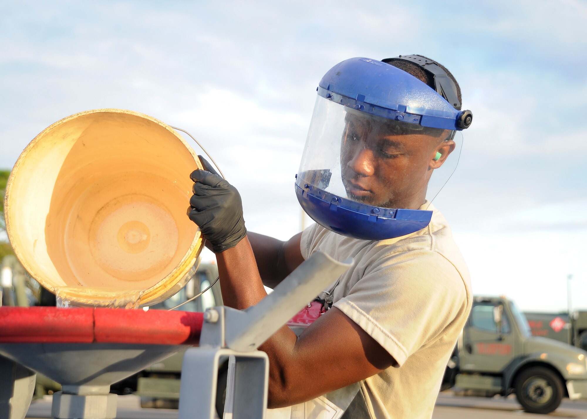 Airman Raymond Randall, a distribution truck operator with the 6th Logistics Readiness Squadron, pours excess fuel into a bowser during a fuel test at MacDill Air Force Base, Fla., Sept. 21, 2016. Fuel testing is performed daily to ensure the quality of the fuel is at its peak. (U.S. Air Force photo by Airman 1st Class Mariette Adams)