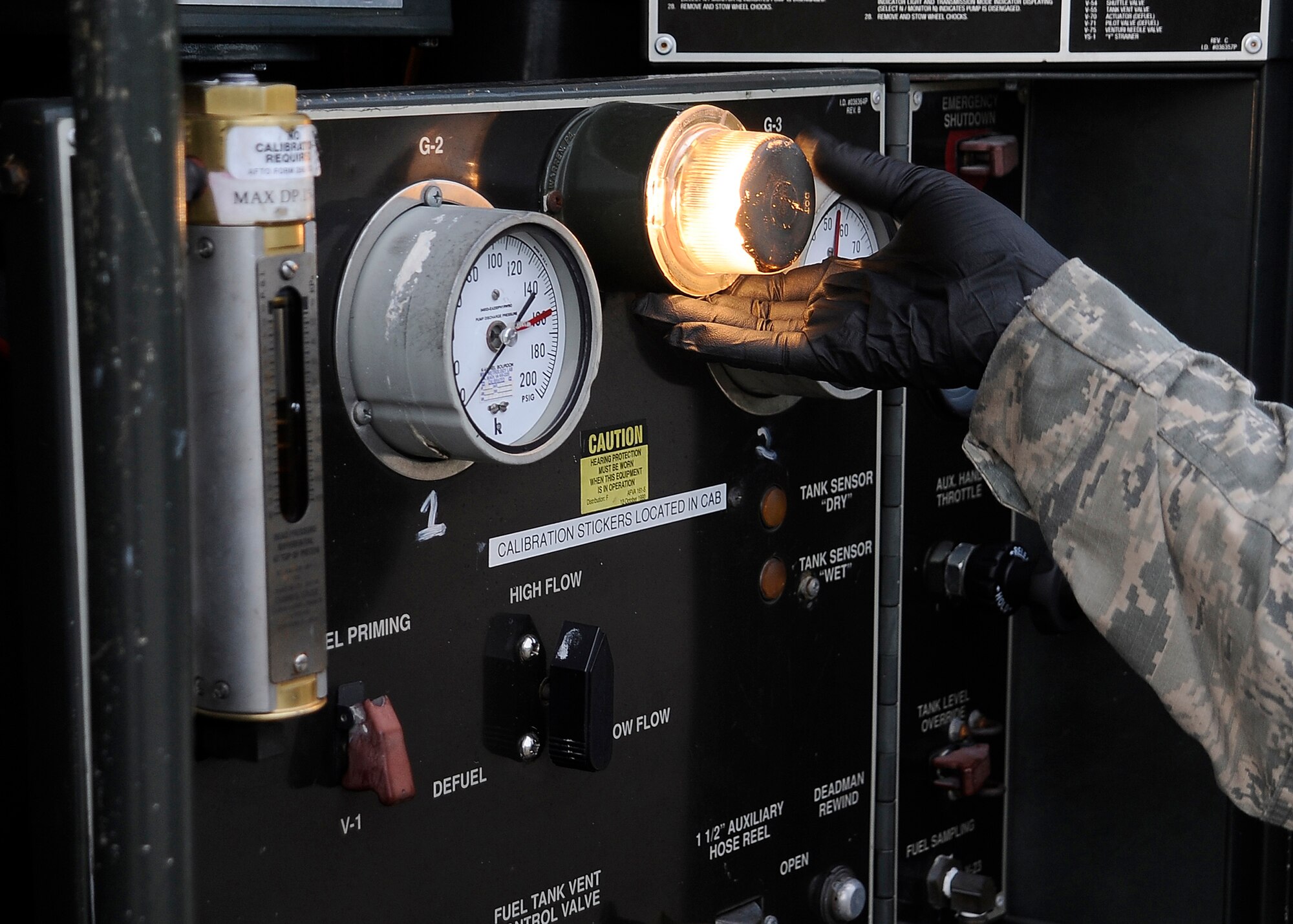 Staff Sgt. Kenya Drake, a refueling supervisor with the 94th Logistics Readiness Squadron, inspects a vehicle at MacDill Air Force Base, Fla., Sept. 21, 2016. Each vehicle has approximately 101 different items that are inspected during the vehicle inspection. (U.S. Air Force photo by Airman 1st Class Mariette Adams)