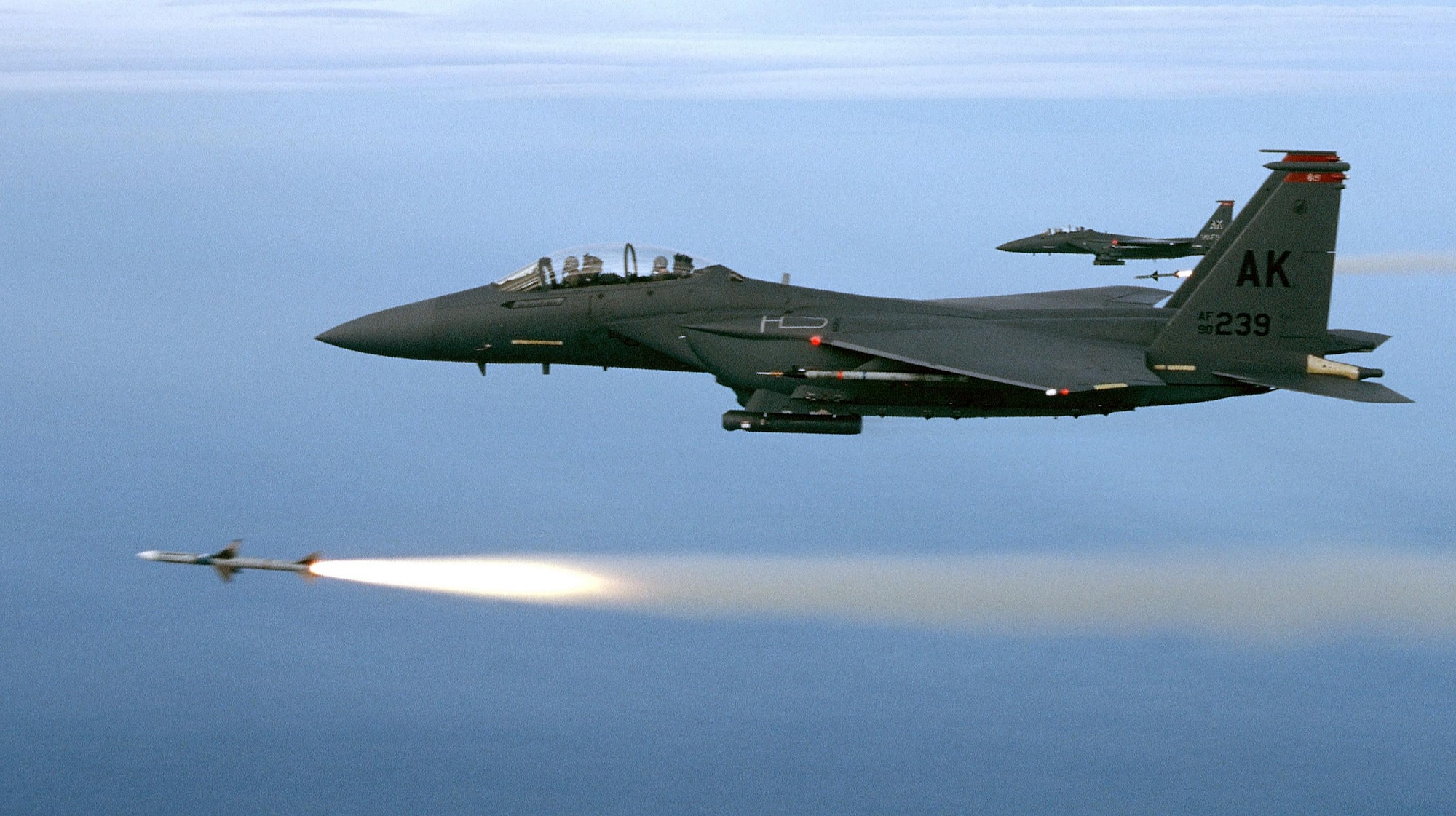 Two F-15E aircraft assigned to the 90th Fighter Squadron, Elmendorf Air Force Base, Alaska, fire AIM-7M's during a training mission over the Gulf of Mexico. (U.S. Air Force Photo)