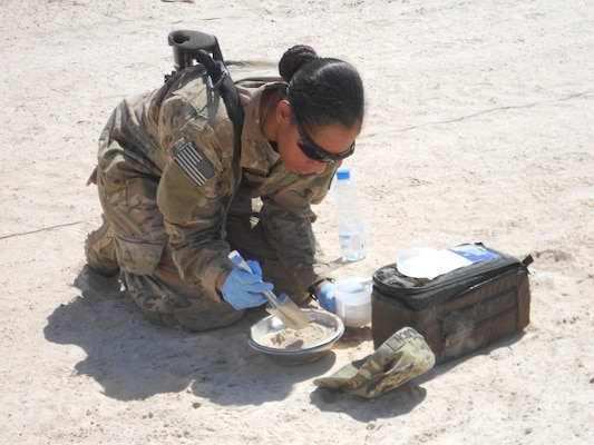 A Soldier inspects a soil sample at Camp Al Taqaddum, Iraq. U.S. forces are readily deployable to anywhere on the planet and have the capability to set up operations under very harsh conditions to meet the required objectives. A set of environmental guidelines is followed to minimize initial impact and alternatives that are more protective of human health and the environment are constantly implemented as operations transition from initial deployment into sustainment.