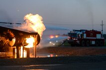 Fire crews from the 788th Civil Engineer Squadron hose an aircraft fire at their training burn pit, Sept. 19, 2016 at Wright-Patterson Air Force Base, Ohio. Aircraft fire training is conducted routinely throughout the year to ensure crews are ready should the need ever arise. (U.S. Air Force photo by Wesley Farnsworth)