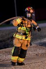 Kirk Buggert, 788th Civil Engineer Squadron lead firefighter, pulls a hose away from an aircraft’s fuselage after successfully putting out a fire during a training exercise at their burn pit, Sept. 19, 2016 at Wright-Patterson Air Force Base, Ohio. Aircraft fire training is conducted routinely throughout the year to ensure crews are ready should the need ever arise. (U.S. Air Force photo by Wesley Farnsworth)