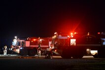 Fire crews from the 788th Civil Engineer Squadron pack up their trucks at the completion of their training held at their training burn pit, Sept. 19, 2016 at Wright-Patterson Air Force Base, Ohio. Crews fought both internal and external aircraft fuselage fires in addition to searching for victims as part of the routine training. (U.S. Air Force photo by Wesley Farnsworth)