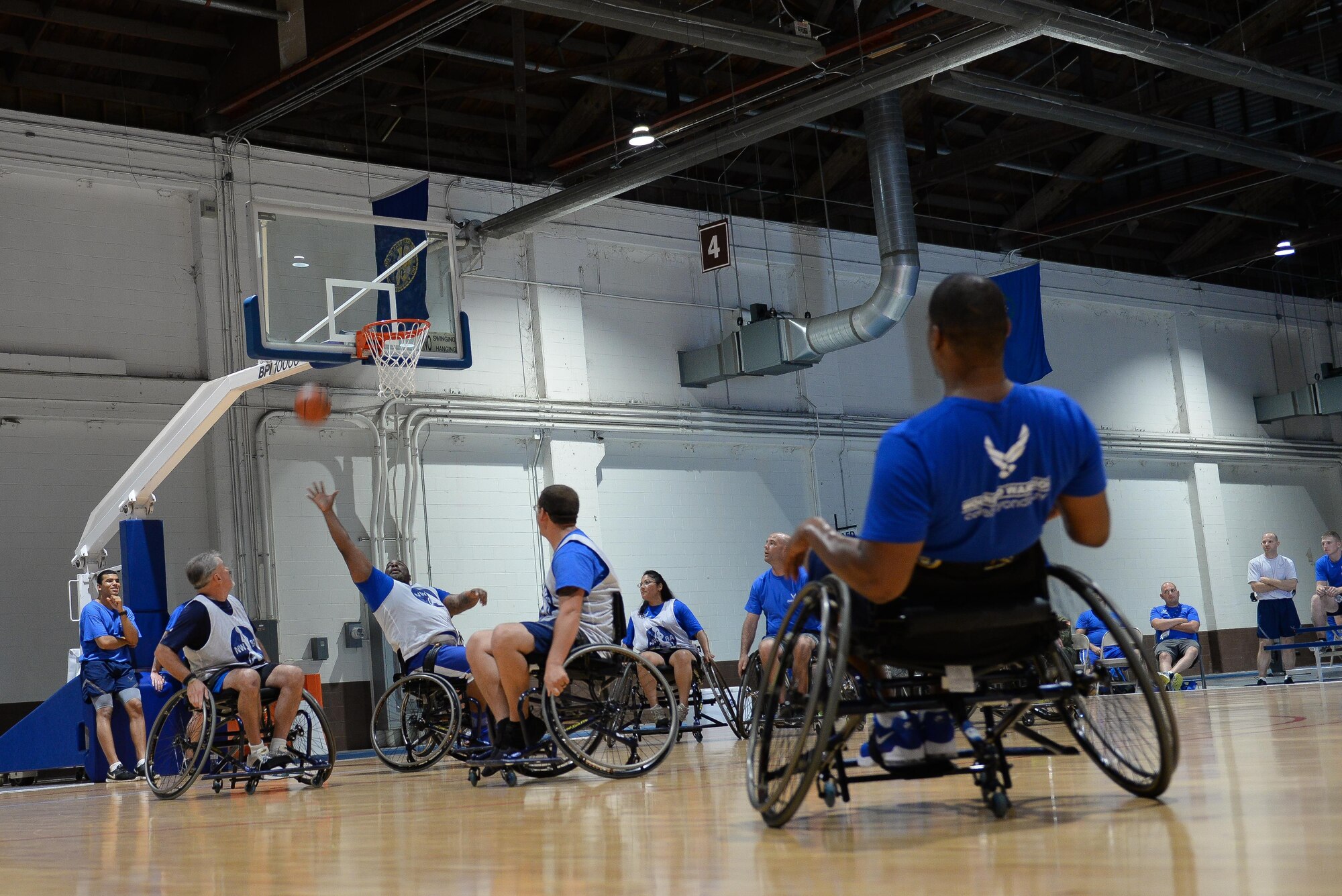 Wounded Warrior Nate Bias tries to intercept a ball during seated basketball in the Offutt Field House at Offutt Air Force Base, Neb., Sept. 21, 2016 during Air Force wounded warrior training. The Wounded Warrior event had 120 current and former Air Force members from across the country participate in sports. (U.S. Air Force photo by Zachary Hada)