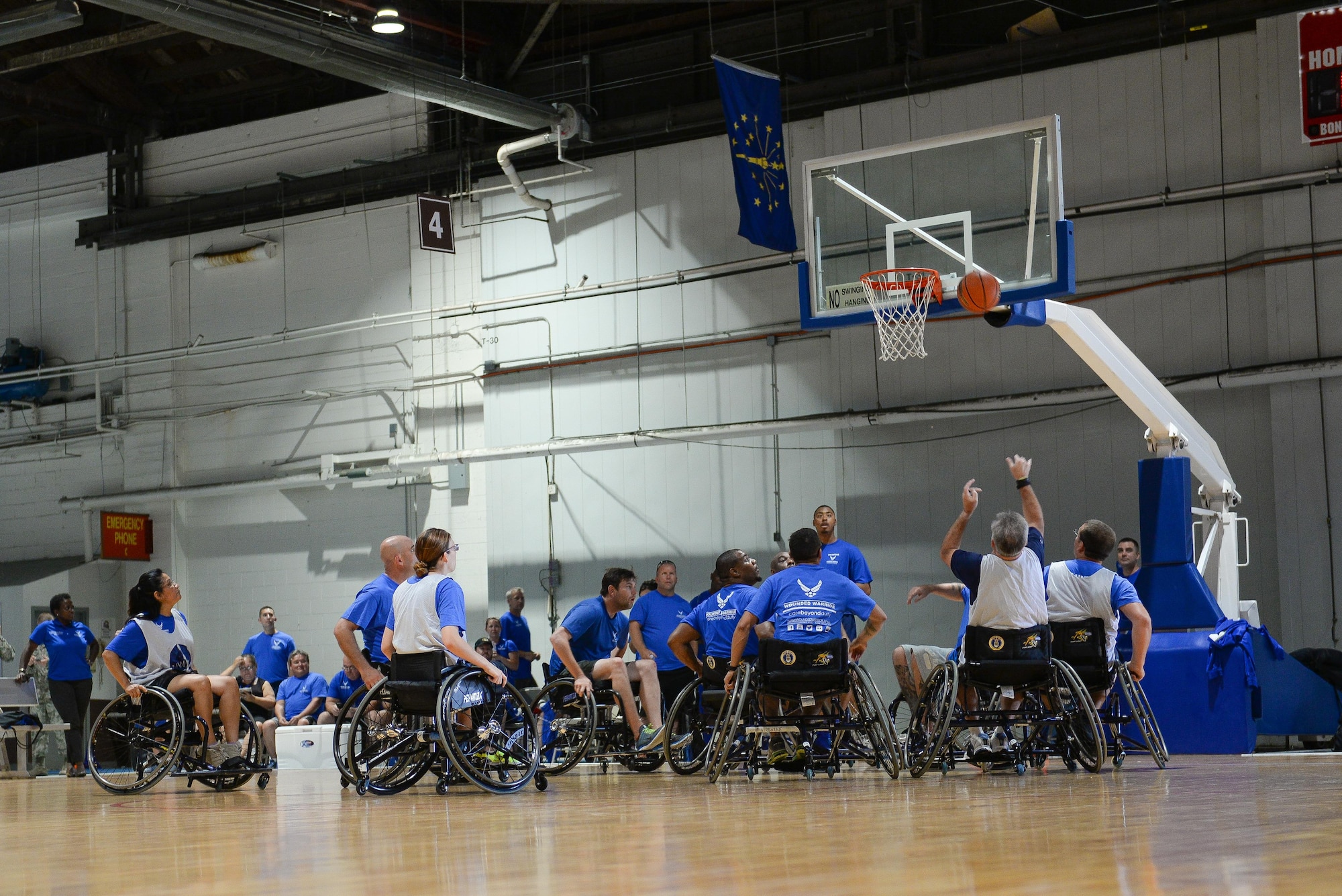 Wounded Warriors play seated basketball in the Offutt Field House at Offutt Air Force Base, Neb., Sept. 21, 2016. Wounded warriors is an adaptive sports competition for wounded, ill and injured service members and veterans. (U.S. Air Force photo by Zachary Hada)