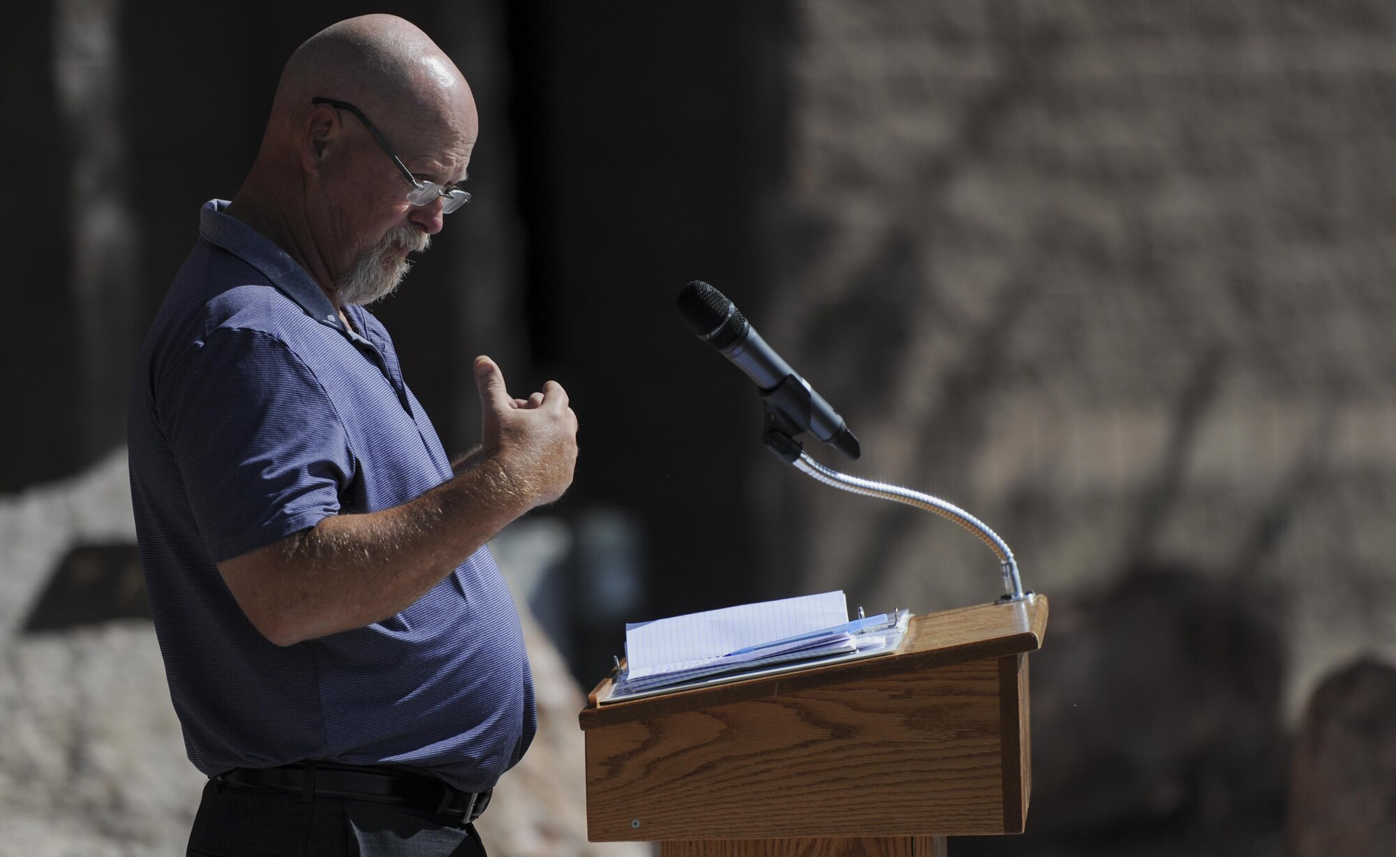 Senior Airman Michael Buras’s father, John Buras, gives his remarks during a dedication ceremony of a new Explosive Ordinance Disposal building at Nellis Air Force Base, Nev., Sept. 21. During the ceremony, retired Air Force Maj. Gen. Timothy Byers, took the time to discuss parts of Buras’ past, including his deployments as an EOD technician. (U.S. Air Force photo by Airman 1st Class Kevin Tanenbaum/Released)