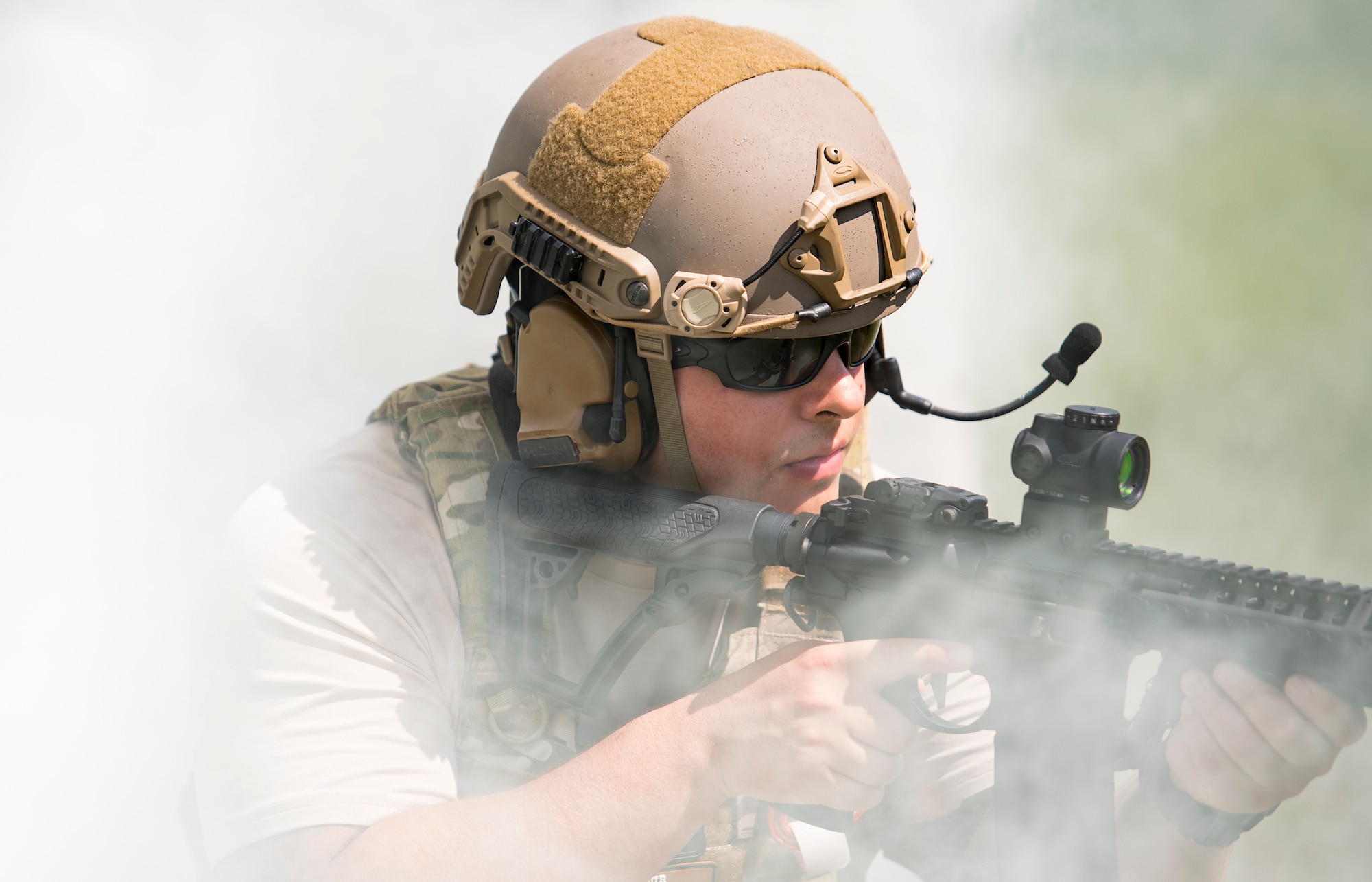 U.S. Air Force Senior Airman Michael Triana, 347th Operations Support Squadron independent duty medical technician-paramedic, looks for targets while providing security for his team during a tactical combat casualty care course, Sept. 22, 2016, in Okeechobee, Fla. During the scenario, the fire team secured the area, found the patient, provided care while under fire, and finally, extracted the patient. (U.S. Air Force photo by Staff Sgt. Ryan Callaghan)