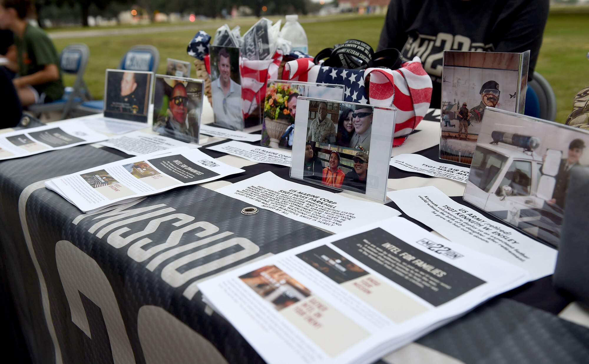 Photos and flyers from the Mission 22 organization are displayed at the 4th Annual Run for Life 5k event on Joint Base San Antonio-Randolph, Texas, Sept. 24, 2016. According to the Mission 22 website, roughly 22 combat veterans commit suicide every day. The organization spreads awareness and acts as a support resource for veterans and their families. (U.S. Air Force photo/Staff Sgt. Jerilyn Quintanilla) 