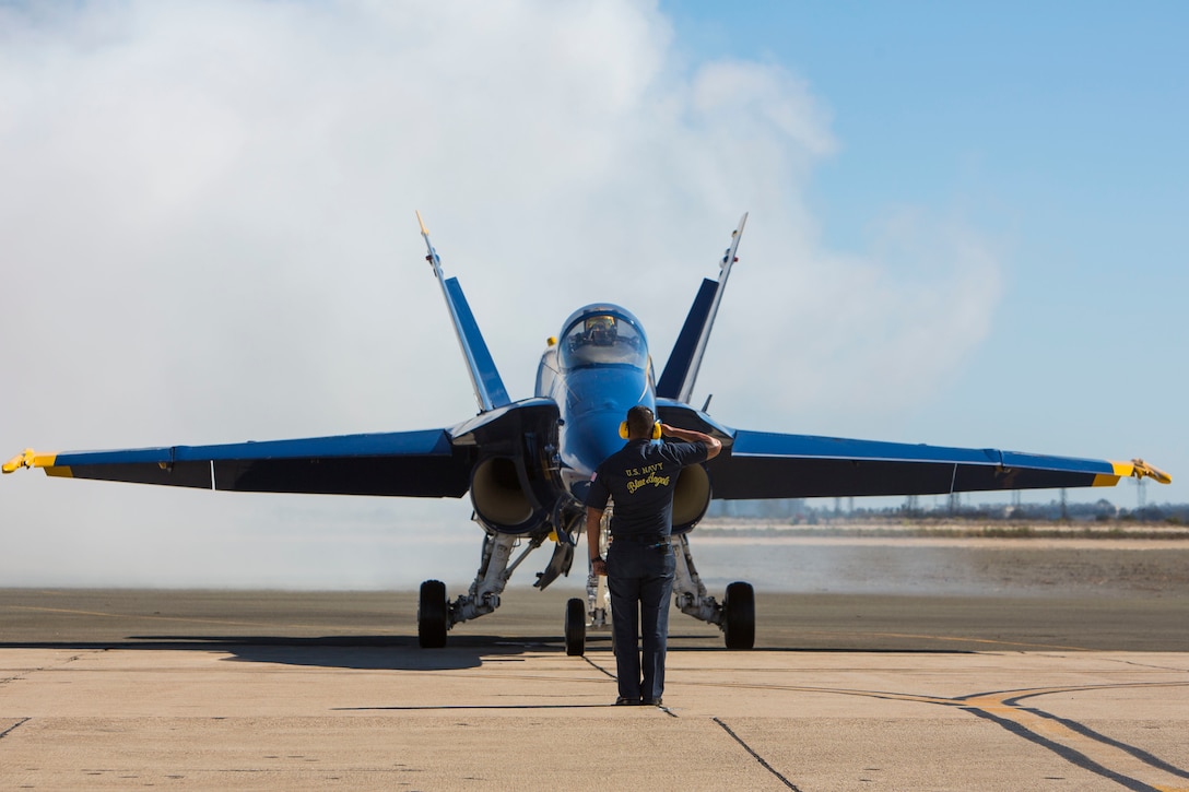 A U.S. Navy Blue Angels crew member renders his salute to a Blue Angels pilot before takeoff during the 2016 Marine Corps Air Station Miramar Air Show at MCAS Miramar, Calif., Sept. 24, 2016. The MCAS Miramar Air Show honors 100 years of the Marine Corps Reserves by showcasing aerial prowess of the Armed Forces and their appreciation of the civilian community’s support to the troops. 