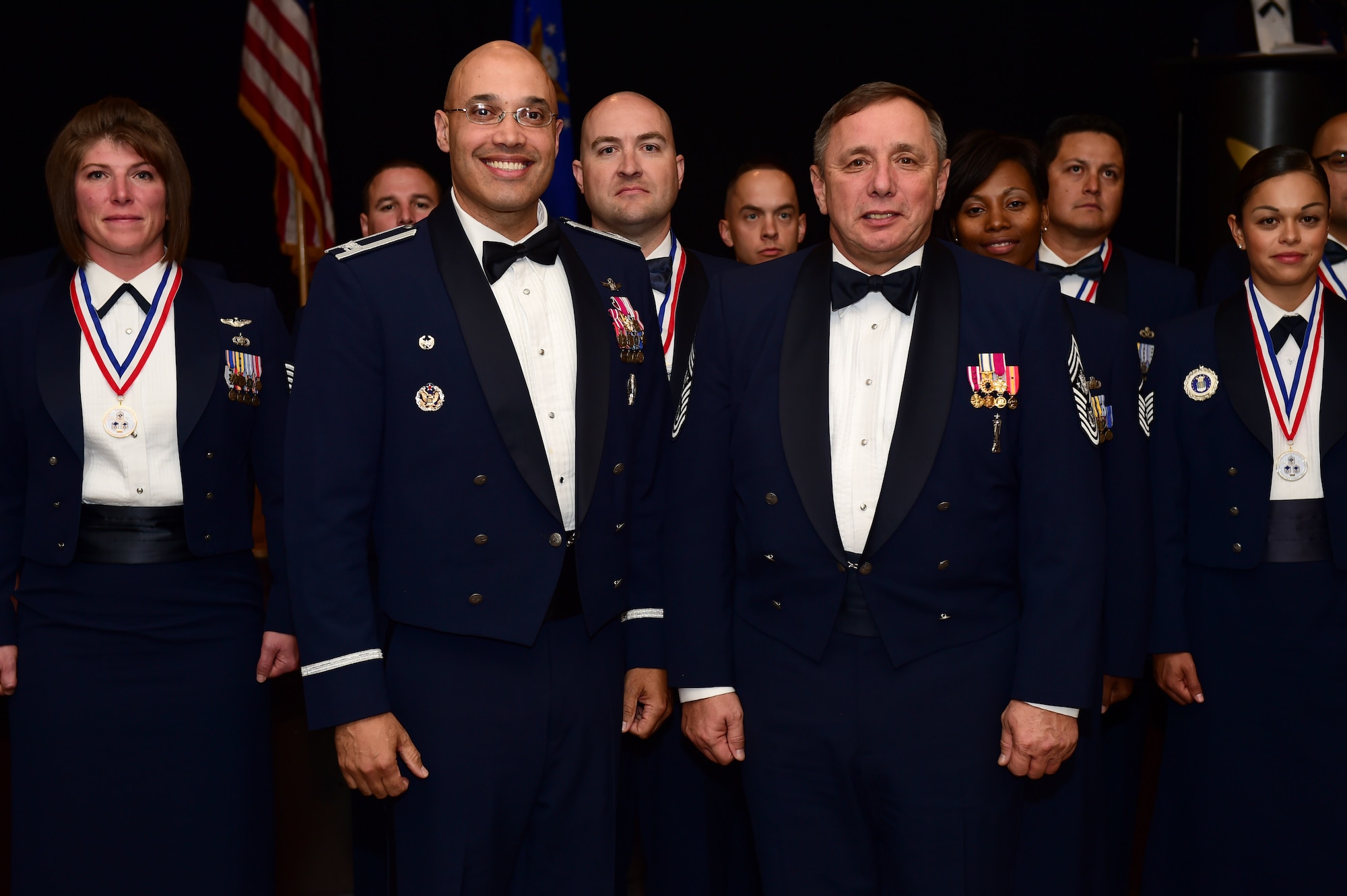 Col. David Miller Jr., 460th Space Wing commander, and former Chief Master Sgt. of the Air Force Frederick J. "Jim" Finch stand together during a senior NCO induction ceremony Sept. 23, 2016, Heritage Eagle Bend Golf Course in Aurora, Colo. Finch spent the day mentoring not only Buckley’s newest SNCO’s, but also members from all ranks. (U.S. Air Force photo by Airman 1st Class Gabrielle Spradling/Released)