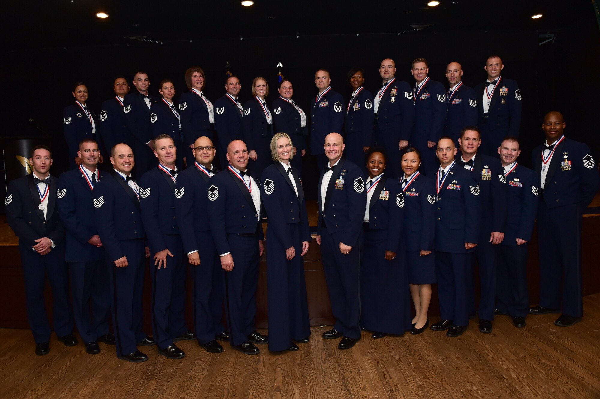 Buckley Air Force Base’s newest senior NCO’s stand together after an induction ceremony Sept. 23, 2016, Heritage Eagle Bend Golf Course in Aurora, Colo. The ceremony is a long-standing Air Force tradition that recognizes those who have reached the rank of master sergeant. (U.S. Air Force photo by Airman 1st Class Gabrielle Spradling/Released)