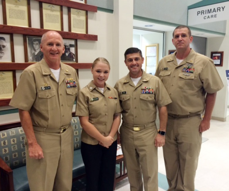 (Left to right) Capt. David Collins, commanding officer, Naval Hospital Jacksonville, Florida, joins Naval Branch Health Clinic-Albany’s team: Petty Officer 3rd Class Hailey McAdams, laboratory assistant, Lt. Cmdr. Kenneth Shaw, officer-in-charge and Chief Petty Officer Eric Jackson in a ceremony to meritoriously promote McAdams, recently. The meritorious achievement, which was held at NBHC-Albany, chronicled a “first” in the Albany clinic’s history.