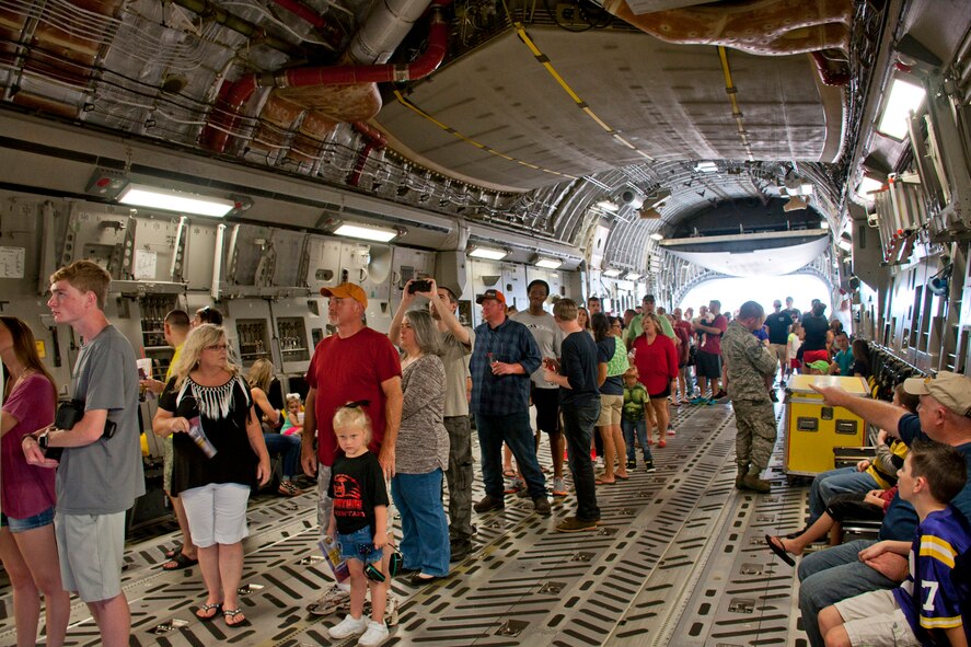 Visitors to the 2016 Arkansas Military Expo wait in the belly of a C-17 Globemaster III, in order to get a close-up look at the cockpit, while at Little Rock Air Force Base, Ark., Sept. 17, 2016. The C-17, which is assigned to the 437th Airlift Wing, Charleston Air Force Base, Joint Base, Charleston, S.C., was just one of the many static displays at the expo, which included a UH-60 Black Hawk, LC-130 Hercules, UH-72A Lakota, T-6A Texan II, AT-6 Texan, PT-17 Stearman, P-51 Mustang, T-28 Trojan and many civilian aircraft. (Courtesy photo by Eva Walston/Released)