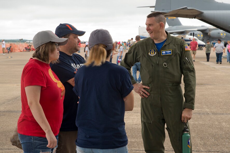 U.S. Air Force Reserve Maj. Scott Lawson, operations officer, 327th Airlift Squadron, speaks with visitors to Little Rock Air Force Base, Ark., during the 2016 Arkansas Military Expo, Sept. 17, 2016. The public event offered a wide variety of attractions for the entire family, including circus acts, static displays, military demonstrations and a petting zoo for children. (U.S. Air Force photo by Master Sgt. Jeff Walston/Released)