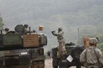 In this file photo, Pfc. Cromwell Downs, Forward Support Company H, 2nd Battalion, 5th Cavalry Regiment, 1st Armored Brigade Combat, 1st Cavalry Division, tosses Meals, Ready-to-Eat, to Soldiers during a distribution validation exercise for the company July 27 at Camp Hovey.