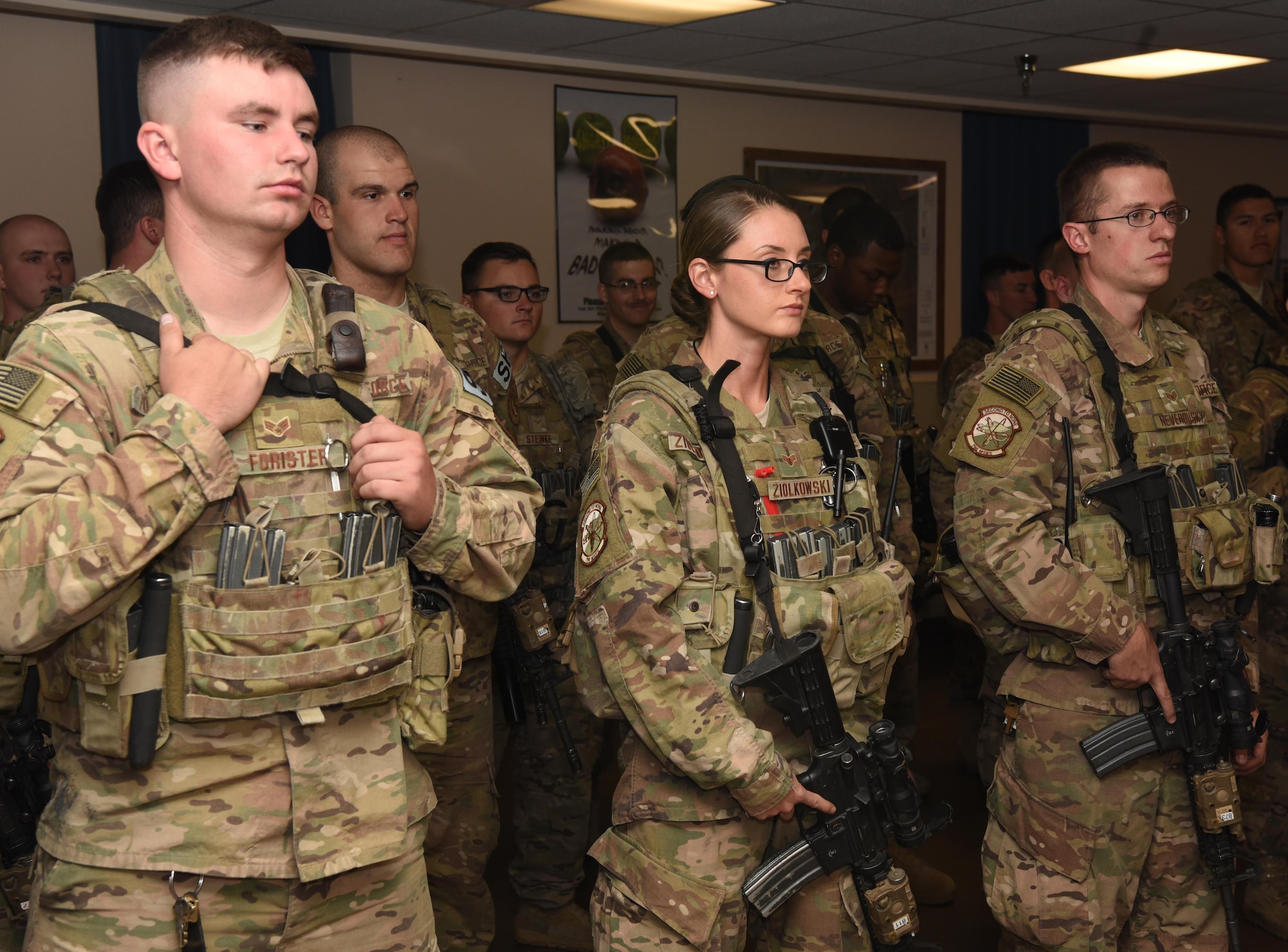 Senior Airman Brianna Ziolkowski, 790th Missile Security Forces Squadron security support team response force leader, receives a briefing during guard mount at F.E. Warren Air Force Base, Wyo., Sept. 16, 2016. During guard mount, defenders checked their equipment, conducted roll call and received their post assignments.