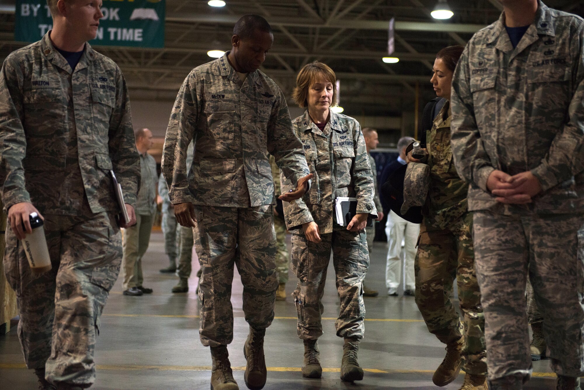 Air Force General Darren McDew, U.S. Transportation Command; commander, looks at a coin as he visits the 715th Air Mobility Command, Joint Base Elmendorf-Richardson to get a boots-on-the-ground perspective of Alaska's joint mission and meet with the Airmen and Soldiers who accomplish it, Sept. 22, 2016. USTRANSCOM is the single manager for global air, land and sea transportation for the Department of Defense.